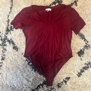 Never worn short sleeve body suit maroon